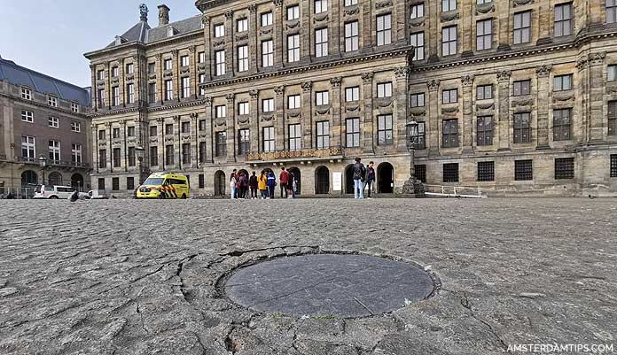 dam square amsterdam nap stone